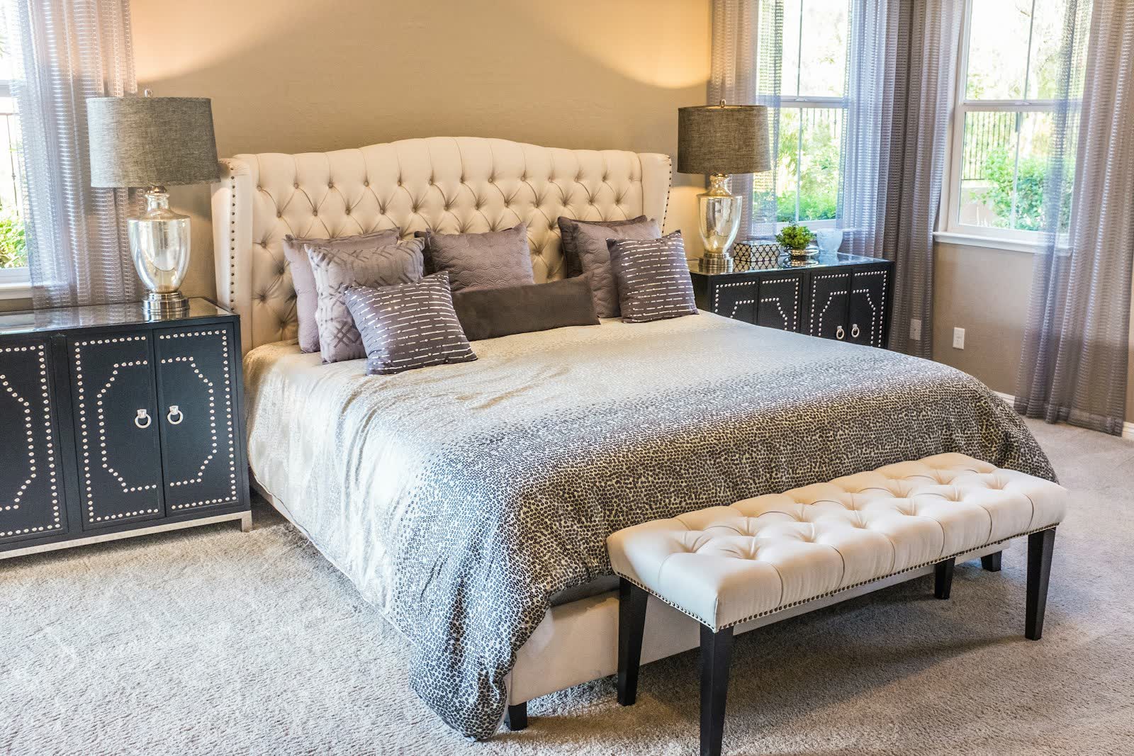 Cozy bedroom with layered neutral bedding and warm textures
